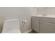 Bathroom featuring a toilet and a modern vanity with a sink at 316 S Roena St, Indianapolis, IN 46241