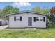 Charming single-story home with gray siding, dark shutters, and a well-maintained front yard at 316 S Roena St, Indianapolis, IN 46241