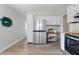 Modern kitchen showcasing stainless steel refrigerator, white cabinets, and butcher block counters at 316 S Roena St, Indianapolis, IN 46241