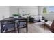 Inviting living room and dining area with modern decor, hardwood floors, and lots of light at 316 S Roena St, Indianapolis, IN 46241