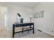 Bright office space with desk, chair, modern light fixtures, and carpeted floor at 316 S Roena St, Indianapolis, IN 46241