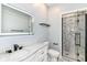 Bathroom features a quartz countertop, a black framed glass shower, and modern finishes at 3241 Ruckle St, Indianapolis, IN 46205