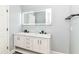 A newly renovated bathroom features a double vanity and marble countertop at 3241 Ruckle St, Indianapolis, IN 46205
