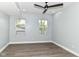 Bedroom features a ceiling fan and natural light from the two windows at 3241 Ruckle St, Indianapolis, IN 46205