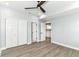Bedroom with ceiling fan, closets, hard surface floors, and an ensuite kitchen at 3241 Ruckle St, Indianapolis, IN 46205