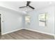 This bedroom features a ceiling fan and natural light from the two windows at 3241 Ruckle St, Indianapolis, IN 46205