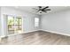 An empty bedroom features a glass sliding door that goes out to a balcony at 3241 Ruckle St, Indianapolis, IN 46205