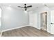 Bedroom featuring a ceiling fan, closet, and an ensuite bathroom at 3241 Ruckle St, Indianapolis, IN 46205