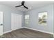 Bright bedroom featuring hardwood floors, two windows and a ceiling fan at 3241 Ruckle St, Indianapolis, IN 46205