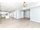 Expansive open-concept living space featuring wood-look floors, a modern kitchen, and plenty of natural light at 3241 Ruckle St, Indianapolis, IN 46205