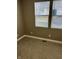 Neutral bedroom with carpet flooring and two windows with blinds for natural light at 336 W 29Th St, Indianapolis, IN 46208