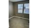 Neutral bedroom featuring carpet flooring and two windows with blinds for natural light at 336 W 29Th St, Indianapolis, IN 46208
