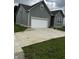 Well-maintained home with a two-car garage and concrete driveway at 336 W 29Th St, Indianapolis, IN 46208