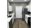 Modern kitchen featuring stainless steel appliances and white cabinets at 336 W 29Th St, Indianapolis, IN 46208