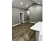 Open living space with white breakfast bar and hardwood floors at 336 W 29Th St, Indianapolis, IN 46208