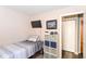 Bedroom featuring a TV, storage cubes, and a closet at 3608 Valley Lake Dr, Indianapolis, IN 46227
