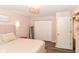 Bedroom featuring hardwood floors, a closet, and a comfortable-looking bed at 3608 Valley Lake Dr, Indianapolis, IN 46227