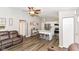 Open concept living area with sleek flooring, stainless steel appliances and a cozy leather sofa at 3608 Valley Lake Dr, Indianapolis, IN 46227
