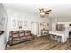 Open concept living space with sleek flooring, stainless steel appliances and a cozy leather sofa at 3608 Valley Lake Dr, Indianapolis, IN 46227