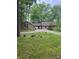 Charming stone house on a sprawling lot with a circular driveway and mature trees at 3692 Whippoorwill Lake S Dr, Monrovia, IN 46157