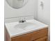 Close-up of the half bathroom's vanity, featuring a white countertop and modern faucet at 3937 Candle Berry Dr, Indianapolis, IN 46235