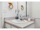 Bathroom with sink, mirror, lighting, and storage for cotton swabs, toothbrushes, and hand towels at 3937 Candle Berry Dr, Indianapolis, IN 46235