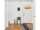 Bright foyer with hardwood floors, white walls, staircase and door with a mail organizer at 3937 Candle Berry Dr, Indianapolis, IN 46235