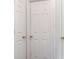 Hallway boasting 3 white paneled doors, each with a gold handle, creating easy access to other rooms at 3937 Candle Berry Dr, Indianapolis, IN 46235