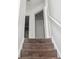 Carpeted stairs leading to the upper level of the home with white railing at 3937 Candle Berry Dr, Indianapolis, IN 46235