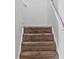 Carpeted stairs leading to the upper level of the home with white railing at 3937 Candle Berry Dr, Indianapolis, IN 46235