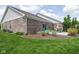 Backyard featuring a brick home, lush green grass, and a patio at 4034 Cairo Way, Avon, IN 46123