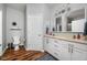 Bathroom featuring double sinks, white cabinets, modern fixtures, and neutral paint at 4034 Cairo Way, Avon, IN 46123