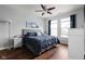 Comfortable bedroom features a ceiling fan, natural light, and neutral wall colors at 4034 Cairo Way, Avon, IN 46123