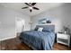 Comfortable bedroom features a ceiling fan, natural light, and neutral wall colors at 4034 Cairo Way, Avon, IN 46123