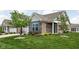 Beautiful brick home with a two-car garage, trimmed lawn and fresh landscaping at 4034 Cairo Way, Avon, IN 46123