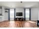 Bright living room with hardwood floors, modern fixtures, and large windows, offering a cozy and inviting atmosphere at 4034 Cairo Way, Avon, IN 46123