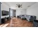 Spacious living room with hardwood floors, a comfortable gray sectional, and ample natural light at 4034 Cairo Way, Avon, IN 46123