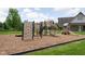 Community playground featuring slides, climbing structures, and a wood chip ground cover at 4034 Cairo Way, Avon, IN 46123