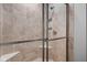 Tiled shower with glass enclosure and built in bench and shampoo nook at 4034 Cairo Way, Avon, IN 46123