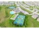Aerial view of community with tennis courts, pool, clubhouse and surrounding neighborhood at 4039 Amaryllis Dr, Plainfield, IN 46168