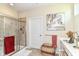 Bright bathroom featuring a glass shower enclosure, vanity, decor, and natural light from a small window at 4039 Amaryllis Dr, Plainfield, IN 46168