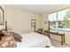 Bright bedroom featuring a four poster bed, sunny window, and traditional decor at 4039 Amaryllis Dr, Plainfield, IN 46168