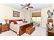 Comfortable bedroom featuring a ceiling fan, sitting area, a wooden chest, and traditional furnishings at 4039 Amaryllis Dr, Plainfield, IN 46168