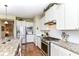 Modern kitchen with granite counters, stainless steel appliances, and stylish white cabinetry at 4039 Amaryllis Dr, Plainfield, IN 46168