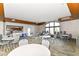 Inviting meeting room with tables, chairs and kitchen area at 4039 Amaryllis Dr, Plainfield, IN 46168