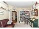 Large office space with a bookshelf, leather couch, natural light, and a cozy atmosphere at 4039 Amaryllis Dr, Plainfield, IN 46168