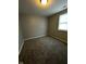 A bright bedroom features neutral paint and soft carpet at 41 S Warman Ave, Indianapolis, IN 46222