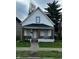 Charming two-story home with white siding, inviting front porch, and well-maintained lawn at 41 S Warman Ave, Indianapolis, IN 46222
