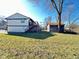 This backyard view showcases ample yard space with a storage shed and access to a deck at 4144 Richelieu Rd, Indianapolis, IN 46226