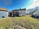 Backyard with a two-story home, covered deck and a detached garage at 4144 Richelieu Rd, Indianapolis, IN 46226